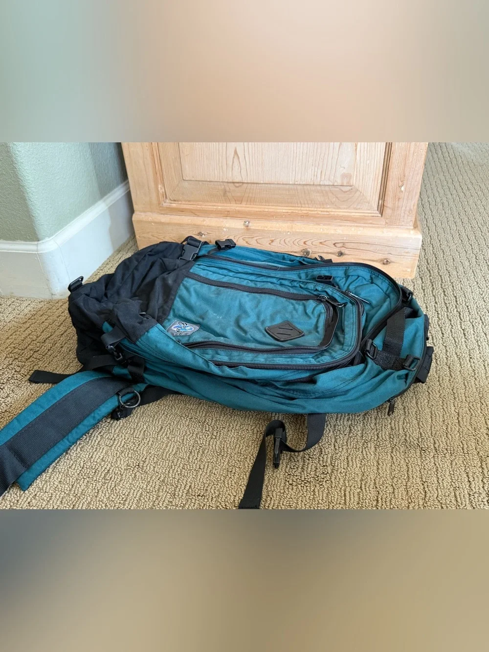 Teal and Black Vintage Eagle Creek Backpack with a day pack attached.